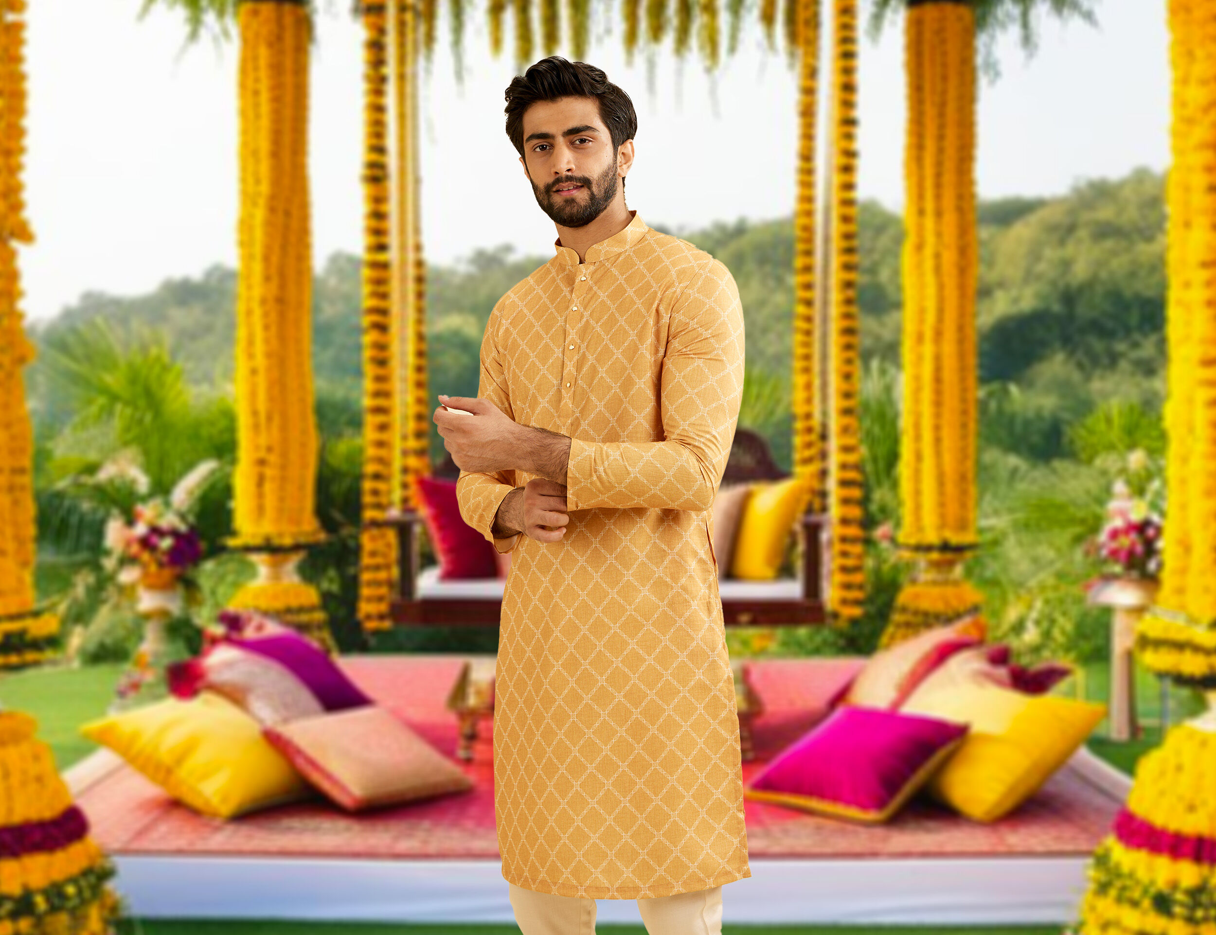 A groom wearing yello pattern kurta pajama for haldi ceremony